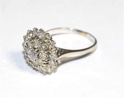 Lot 178 - A diamond and white stone cluster ring, three tiers of round brilliant cut diamonds and one...