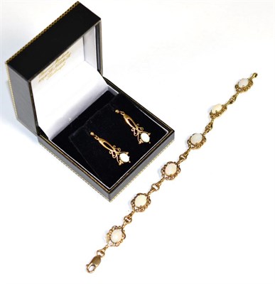Lot 187 - A 9 carat gold opal bracelet and earring suite, oval cabochon opals to scroll frames, bracelet...