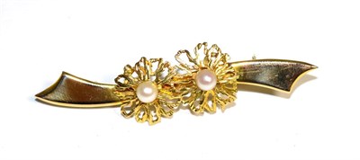 Lot 192 - A cultured pearl cluster bar brooch, two cultured pearls to textured and pierced circular...