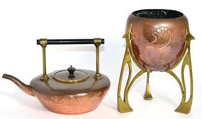 Lot 206 - An Art Nouveau copper and brass planter, on three pierced supports and a copper and brass kettle