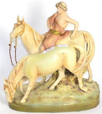Lot 219 - A Royal Dux figural group, modelled as a classical figure on a horse