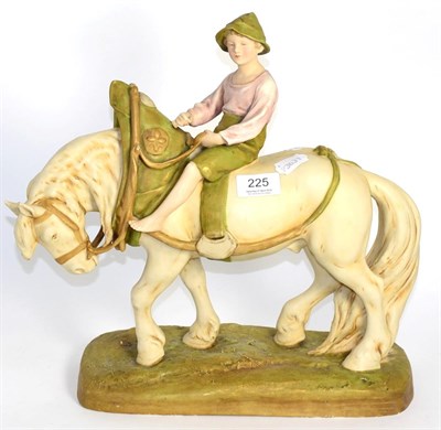 Lot 225 - A Royal Dux figural group, modelled as a boy on a heavy horse