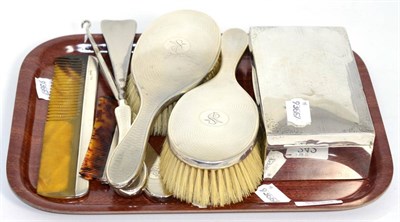 Lot 242 - Six silver backed/handled dressing table items and a silver cigarette box (7)