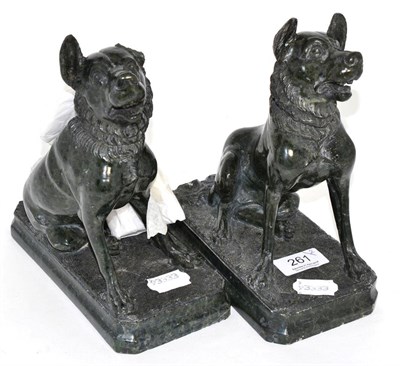 Lot 261 - A pair of sculpted green serpentine models of seated dogs on plinth bases (a.f.)