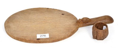 Lot 276 - A Robert Mouseman Thompson English oak cheese board, with carved mouse signature; and a Robert...