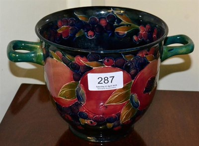 Lot 287 - A Moorcroft pottery Pomegranate pattern twin handled vase, with painted and impressed marks, 13.5cm