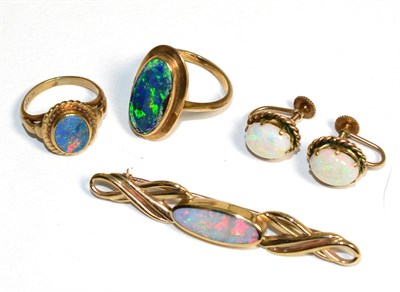 Lot 303 - A black opal ring, finger size G, another black opal ring (af, opal chipped), a pair of opal...