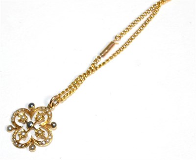 Lot 329 - An Art Nouveau seed pearl pendant, on chain, a quatrefoil pendant set throughout with white, silver