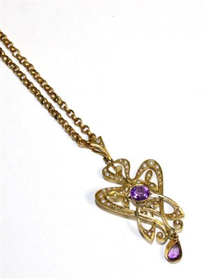 Lot 333 - An Art Nouveau amethyst and seed pearl pendant, on chain, a round cut amethyst in a milgrain...