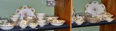 Lot 377 - A part service of Tuscan 'Windsor' pattern dinnerwares on two shelves