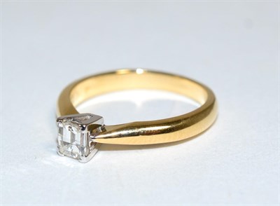 Lot 398 - An 18 carat gold Millennium cut solitaire diamond ring, in a claw setting, to knife edge shoulders