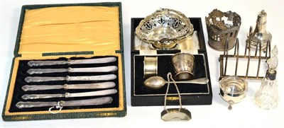 Lot 408 - A collection of silverware including a small toast rack, Birmingham, 1945; a small pedestal basket