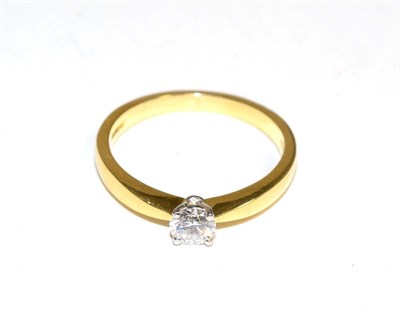 Lot 413 - An 18 carat gold solitaire diamond ring, a round brilliant cut diamond in a claw setting, to...