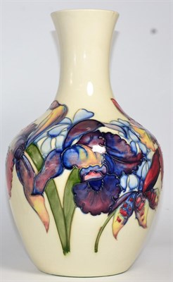 Lot 427 - A Walter Moorcroft pottery Orchid and Spring Flowers pattern vase on a white ground, with...