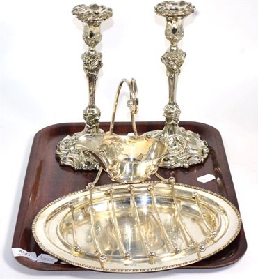 Lot 450 - A pair of Elkington & Co silver plated candlesticks and a plated asparagus tray