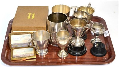 Lot 453 - A silver Christening mug; plated trophies; watercolour miniatures; and gilt metal plaques on...