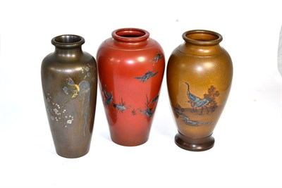 Lot 457 - Three Japanese vases, circa 1910, vases decorated with cranes, foliage and a cockerel