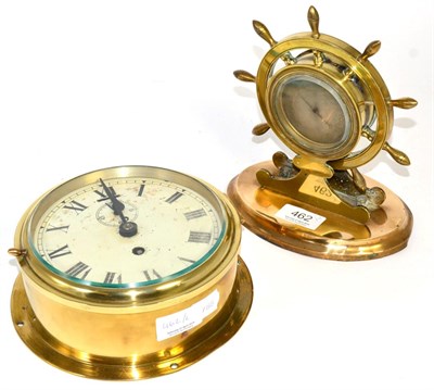 Lot 462 - A ships wheel novelty mantel aneroid barometer and a brass ships type bulk head wall timepiece (2)