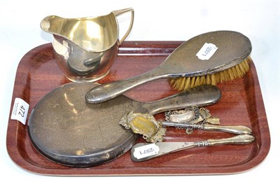 Lot 472 - Miscellaneous silver including cream jug, Chester 1915; with spirit labels, mirror, brush etc (8)