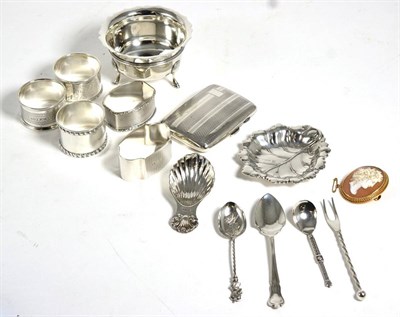 Lot 482 - A quantity of silver items including five silver napkin rings, cigarette leaf form pin tray,...