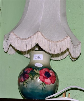 Lot 489 - A Moorcroft table lamp in the poppy pattern, 21cm (excluding fitting)