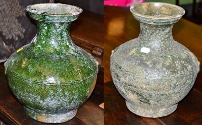 Lot 493 - Two Chinese Han dynasty style green glazed Hu vases bearing old Christie's labels