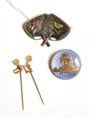 Lot 500 - A Victorian Aesthetic movement Japanese fan brooch, with a glazed locket back containing...