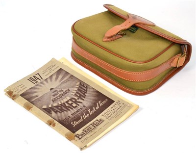 Lot 516 - A Brady cartridge bag, in green canvas with leather trim, buckled fastener and strap, stamped 75; a