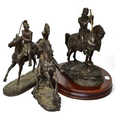 Lot 517 - Three resin bronzes, two comprising military figures on horseback, the other as a knight on a horse