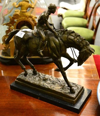 Lot 528 - A cast bronze figure of a horse and jockey, stone base