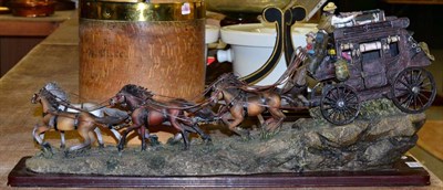 Lot 1011 - A resin figure group of a carriage and horses