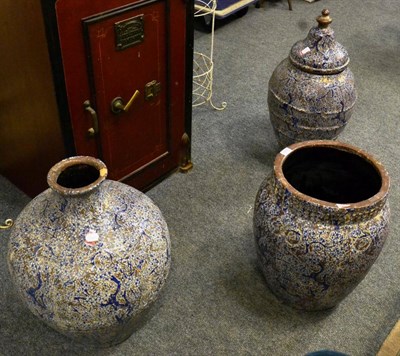 Lot 1076 - Two decorative blue glazed terracotta urns and a matching jar and cover