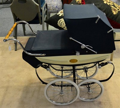 Lot 1081 - A Silver Cross Millennium pram, No 0704 with blue painted chassis and blue fabric hood