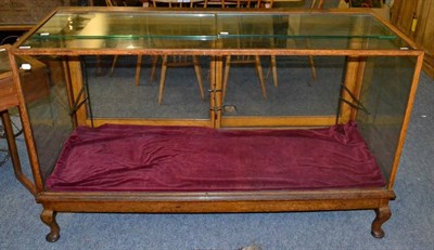 Lot 1086 - Early 20th century oak glazed shop display cabinet