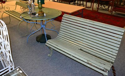 Lot 1172 - Two slatted wooden garden benches and a modern garden table and parasol