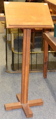 Lot 1177 - An Acorn Industries oak lectern, on a quatrefoil column and base, with a recessed carved acorn...