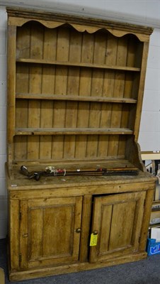 Lot 1183 - A pine dresser and rack