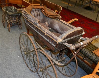 Lot 1184 - A Windsor style rocking chair, a Victorian perambulator and a Victorian dolls pram