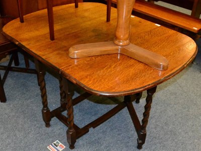 Lot 1196 - A 1920s oak gateleg table