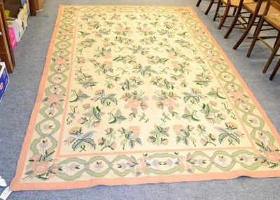 Lot 1212 - Portugese machine made flatweav carpet, the ivory field with an allover design of semi naturalistic