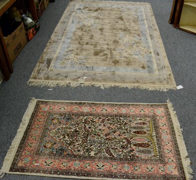 Lot 1215 - A Chinese rug, the field of semi naturalistic flowering plants enclosed by narrow borders, 245cm by