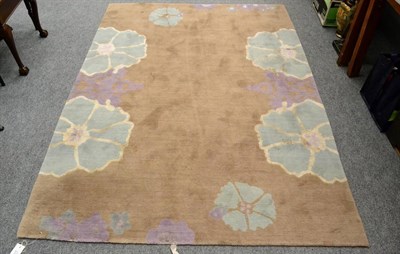 Lot 1217 - A modern machine made Harem rug, decorated with stylised flowers on a coffee field