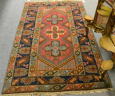 Lot 1221 - Dosemalti rug, West Turkey, the rose field with three cruciform medallions, enclosed by indigo...