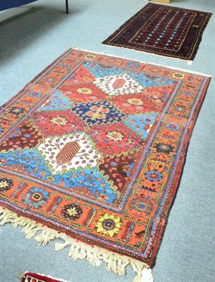 Lot 1225 - West Iranian village rug, the polychrome stepped lattice field enclosed by rust borders, 205cm...