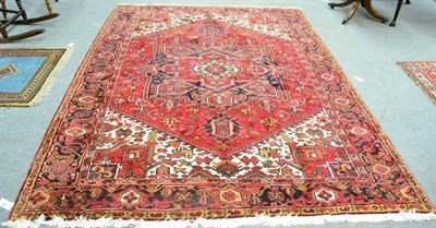 Lot 1228 - Heriz carpet, Iranian Azerbaijan, the blood red field of angular vines around a cruciform medallion