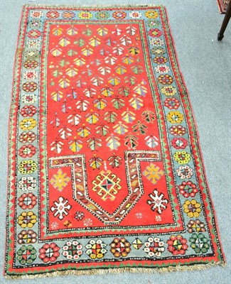 Lot 1230 - Karabagh prayer rug, South Caucasus, the tomato field of stylised plants beneath the Mihrab...