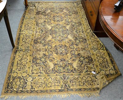 Lot 1233 - Machine made rug of Oriental design, the field with animals enclosed by calligraphic borders, 206cm