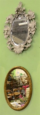 Lot 1236 - A painted carved wooden mirror, together with a gilt framed oval mirror