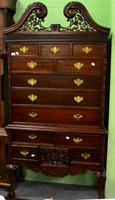 Lot 1237 - A reproduction Chippendale style hardwood chest on stand, with scrolled pediment above eight...