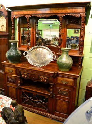 Lot 1238 - A late Victorian carved walnut mirror back sideboard, with superstructure back, the base of...